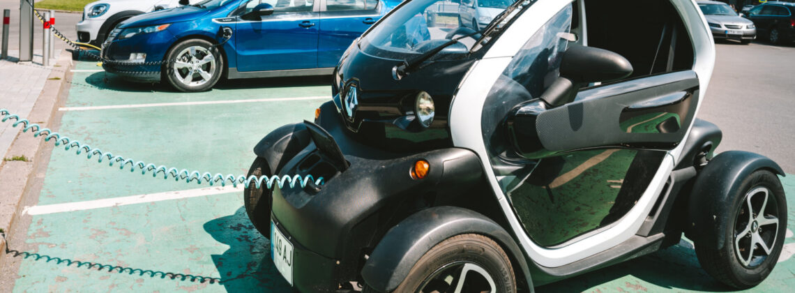 Charging Renault electric car. Twizy is a two-seat electric microcar designed and marketed by Renault