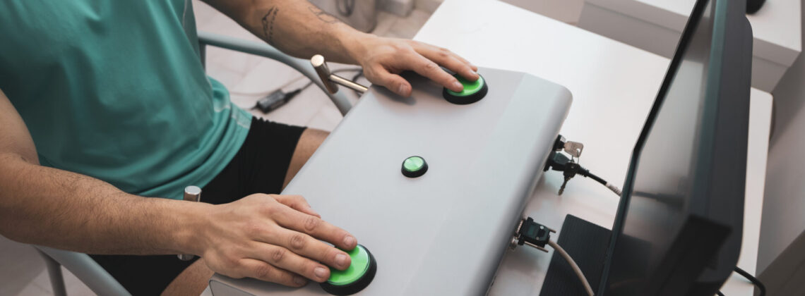 A young man undergoes a bimanual visual-motor coordination test to get his driver’s license.